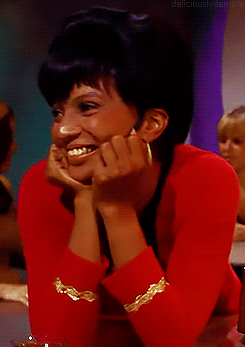 Uhura happily looking from side to side