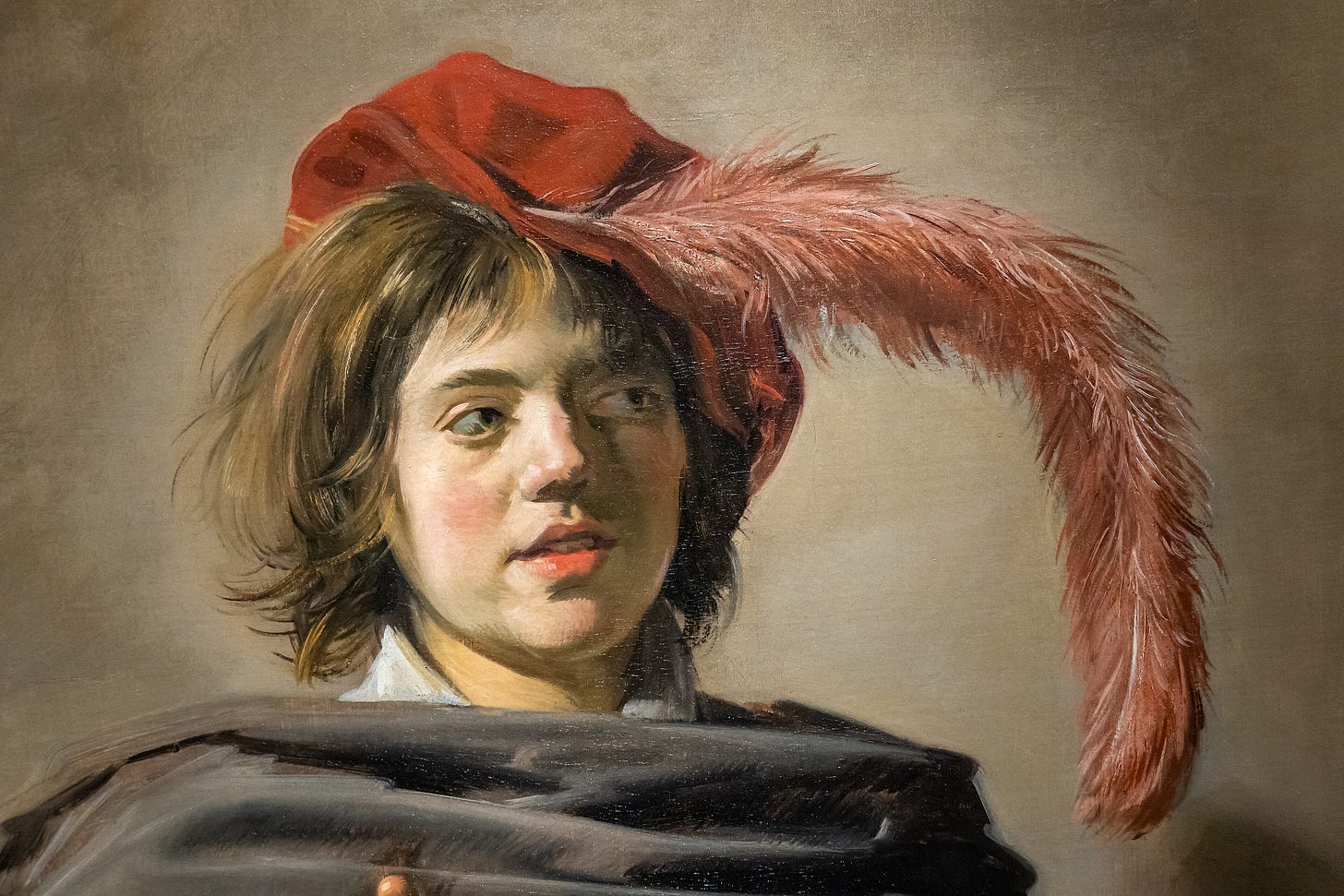 A young man in a plumed hat holding out a skull A young man in a plumed hat holding out a skull