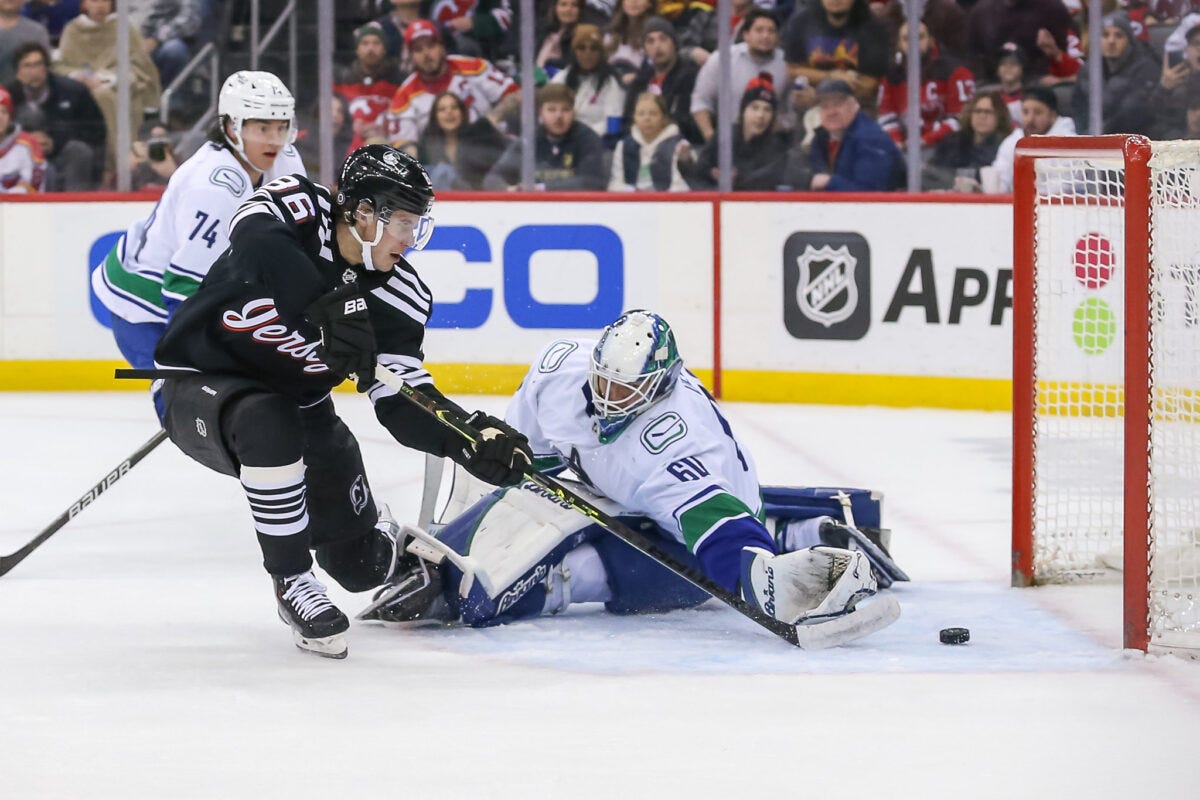 Jack Hughes New Jersey Devils Collin Delia Vancouver Canucks Jack Hughes New Jersey Devils Collin Delia Vancouver Canucks
