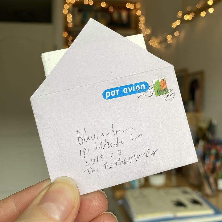 Tiny handmade envelope with stamp