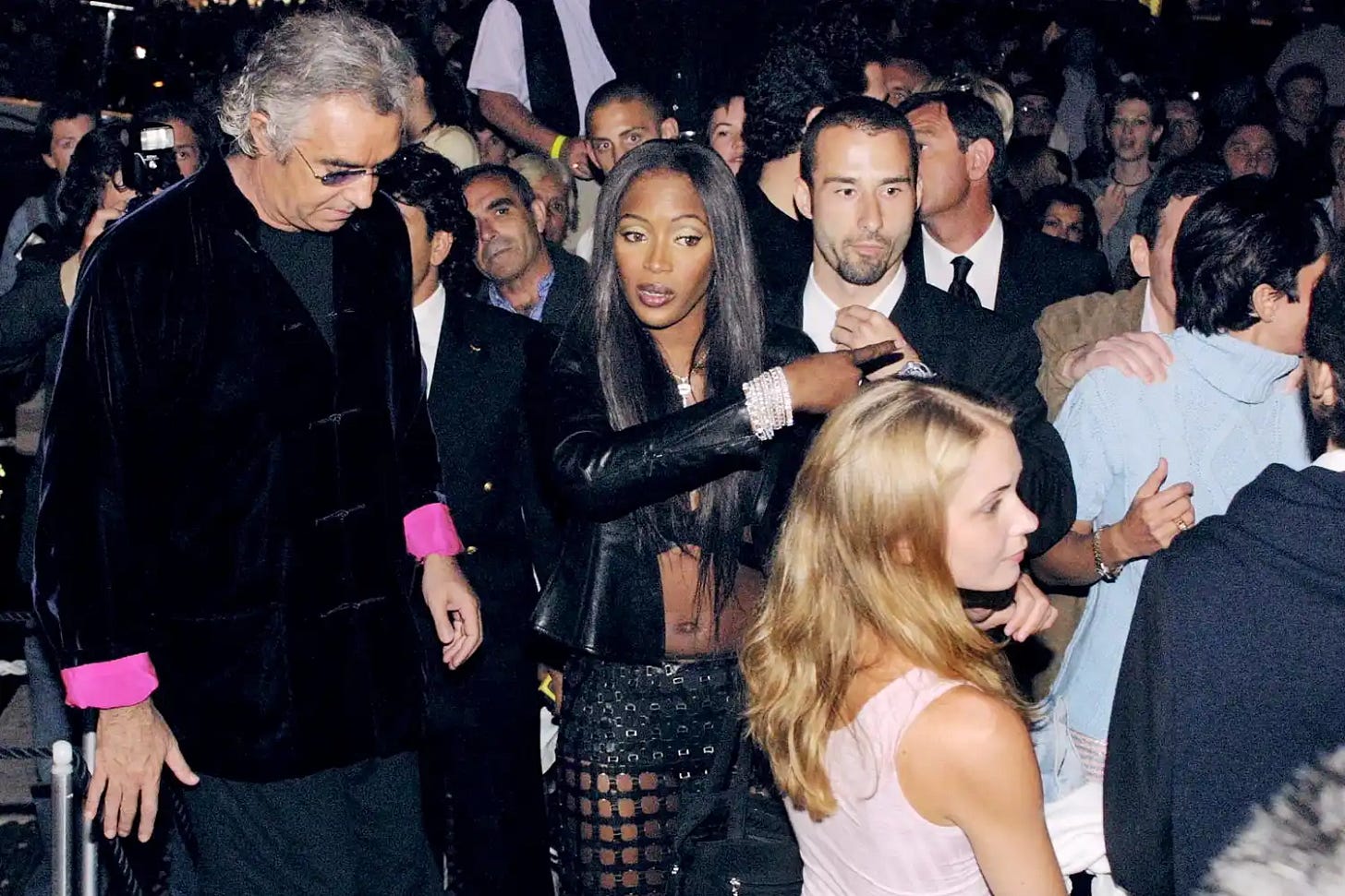 Italian entrepreneur Flavio Briatore and British top model Naomi Campbell at her 31st birthday party in St Tropez, France, 19th May 2001; Virginia Roberts is in the foreground with Ghislaine Maxwell on right