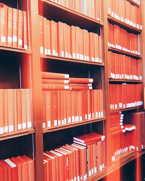 Three photos of library shelves full of books.