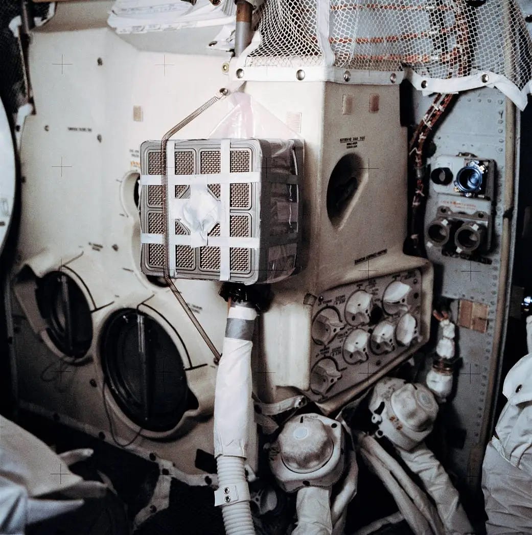 The improvised carbon dioxide scrubber aboard the Apollo 13 lunar module, built from a command module canister, cardboard and duct tape. The improvised carbon dioxide scrubber aboard the Apollo 13 lunar module, built from a command module canister, cardboard and duct tape.