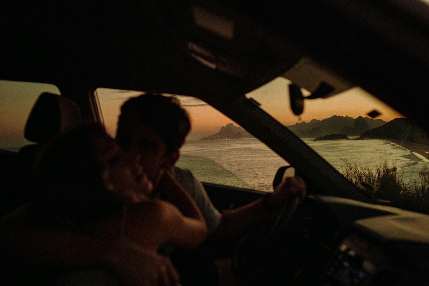 couple driving along the coast