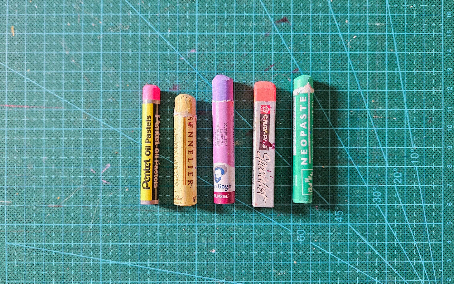5 oil pastels of different brands