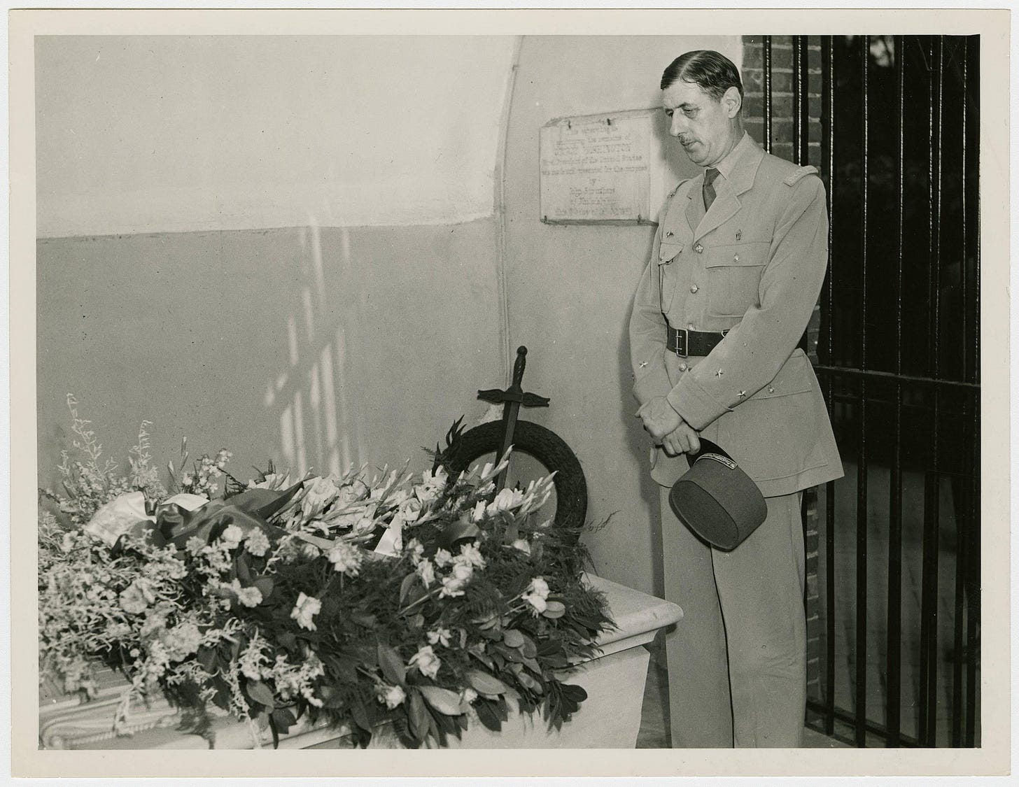 General Charles de Gaulle pays his respects at the tomb of George Washington at Mount Vernon, 1944.