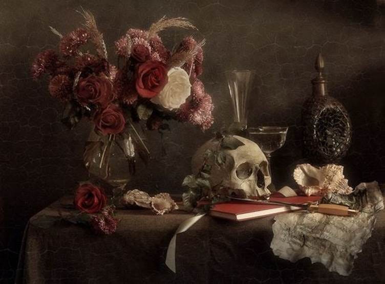 This may contain: a still life with flowers and a skull on a table