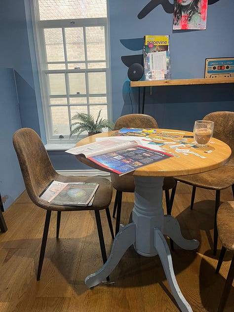 Three event images which include vision boards in progress - a cardboard base with cut out images from various magazines.