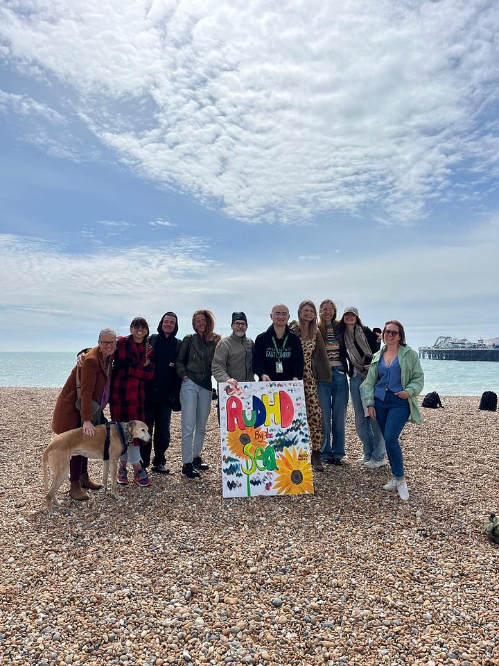 Image 1) Photo of a completed fungi botanical artwork style puzzle at a neurodivergent friendly cafe called Puzzle Bored in Brighton, UK. 2) Picture of Brighton beach on a sunny spring day with members of an event run by Leanne Maskell called 'AuADHD by the Sea'. The group holds up an artwork picture created by Leanne. Dog also in attendance