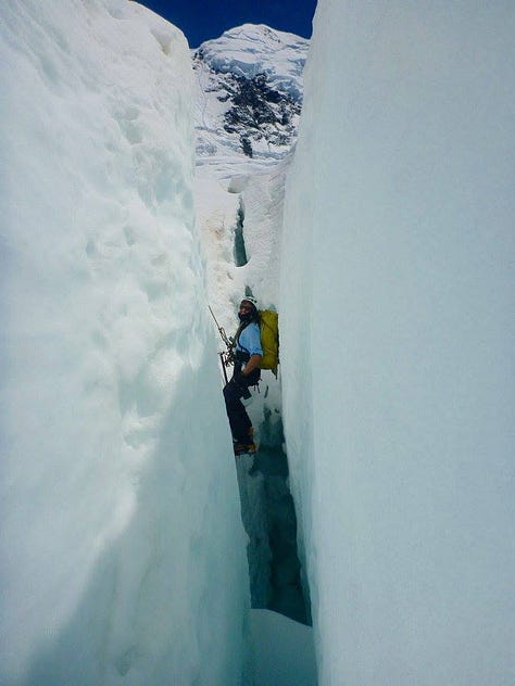 Images of the Himalayas and Alan crossing a glacier, and suspended down a crevasse