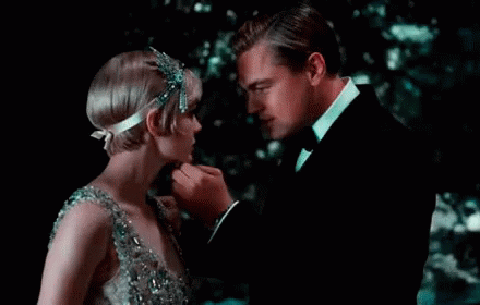Great Gatsby Jay Holding Daisys Face GIF