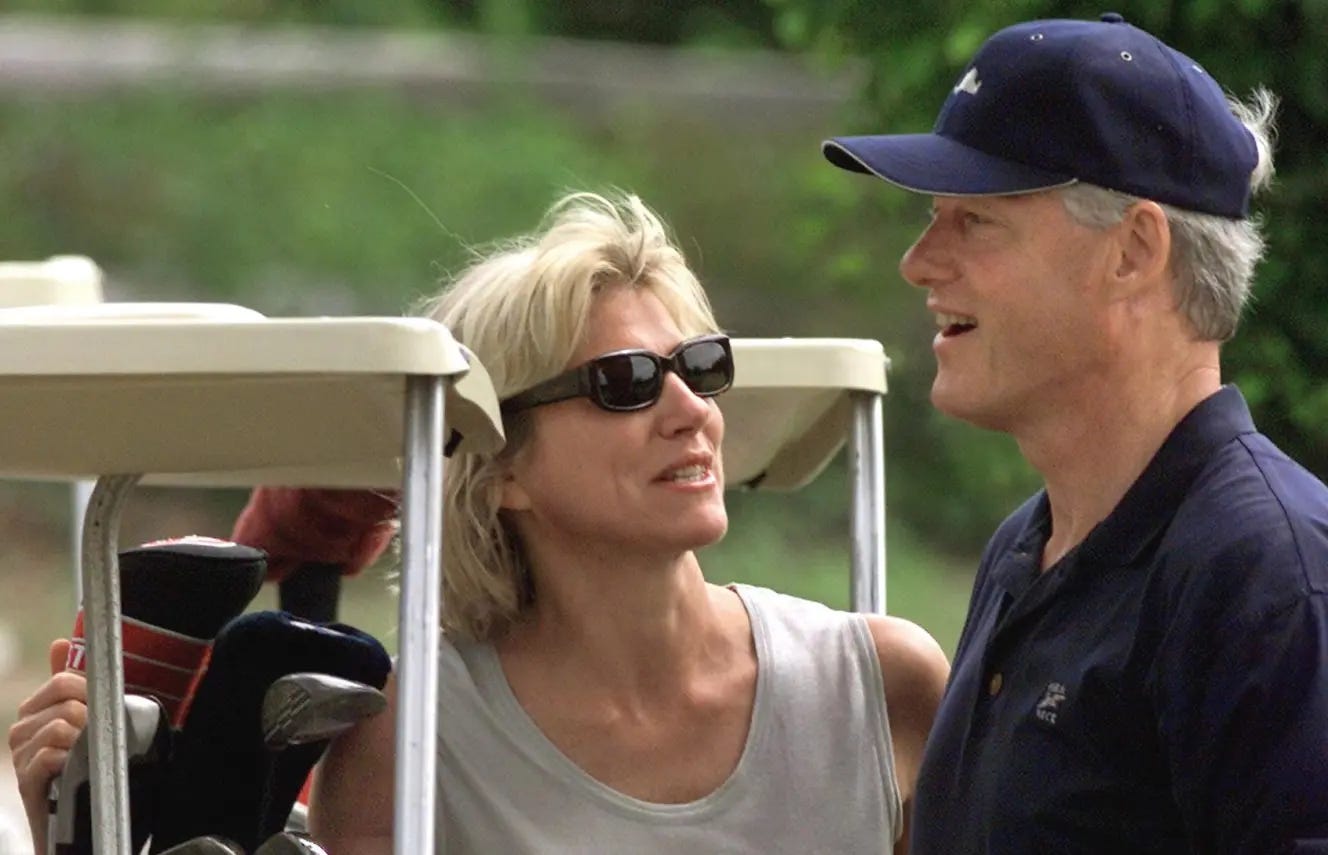 US President Bill Clinton speaks with Lynn Forester at the Farm Neck Golf Club.