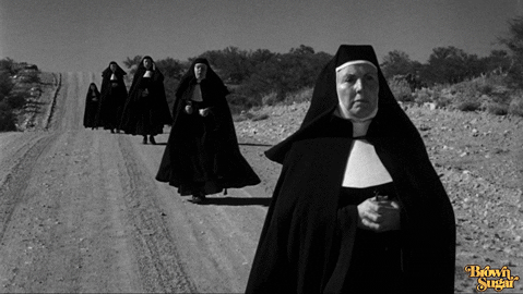Nuns walking in the desert GIF