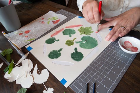 Participants working on their stencil paintings