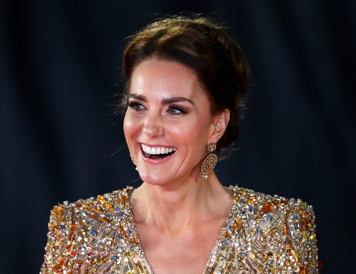 Princess Catherine in a gold sparkly dress