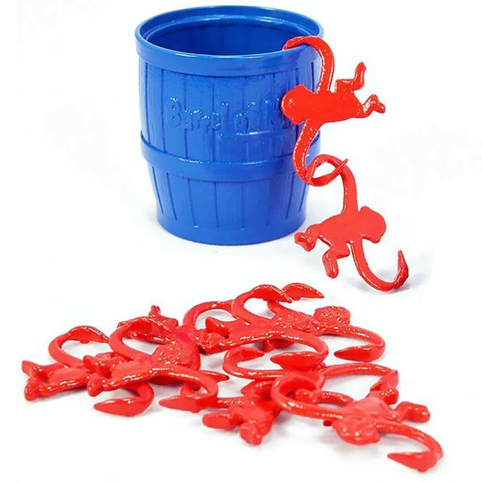 A blue plastic barrel with red plastic hook-armed monkeys around it.
