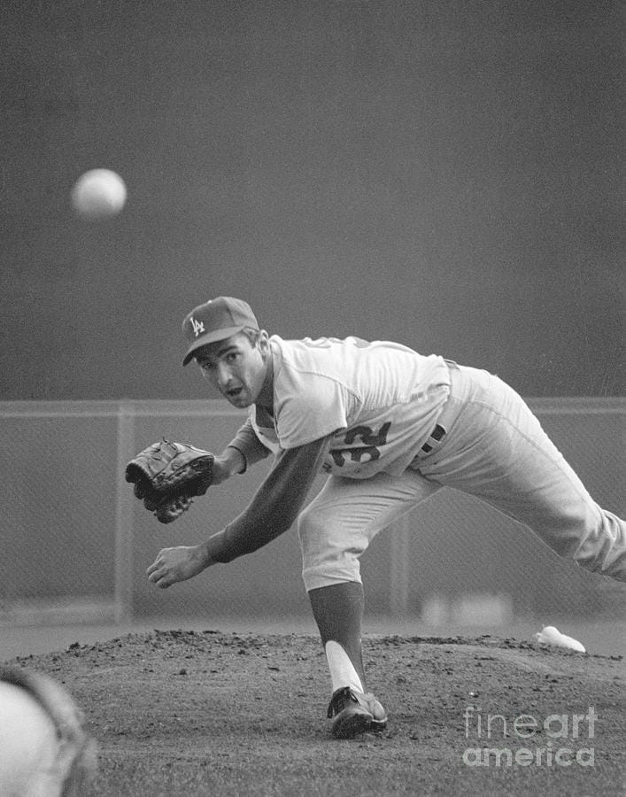 Sandy Koufax Pitching In 1965 World by Bettmann