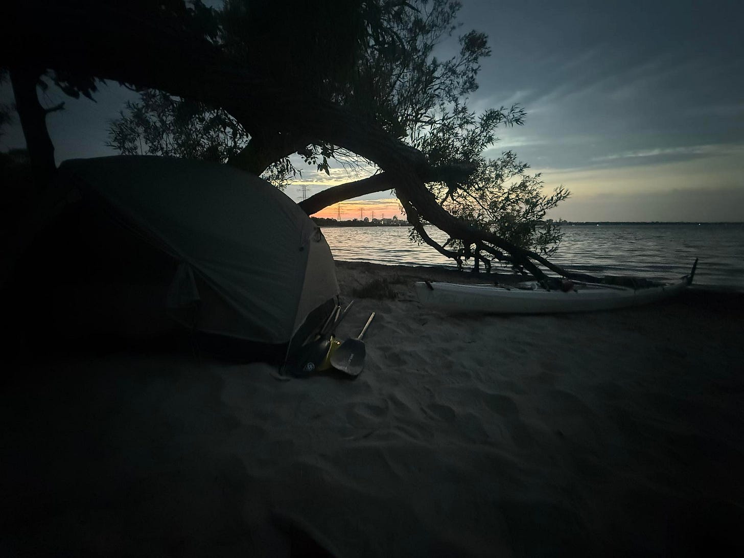 May be an image of campsite, twilight and beach
