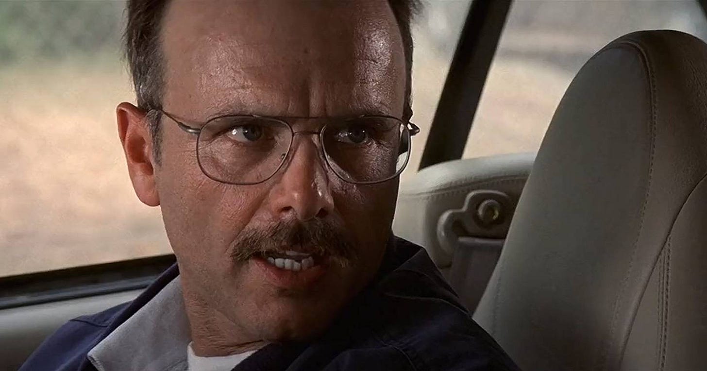 Joe Pantoliano looking angry in a car in Memento