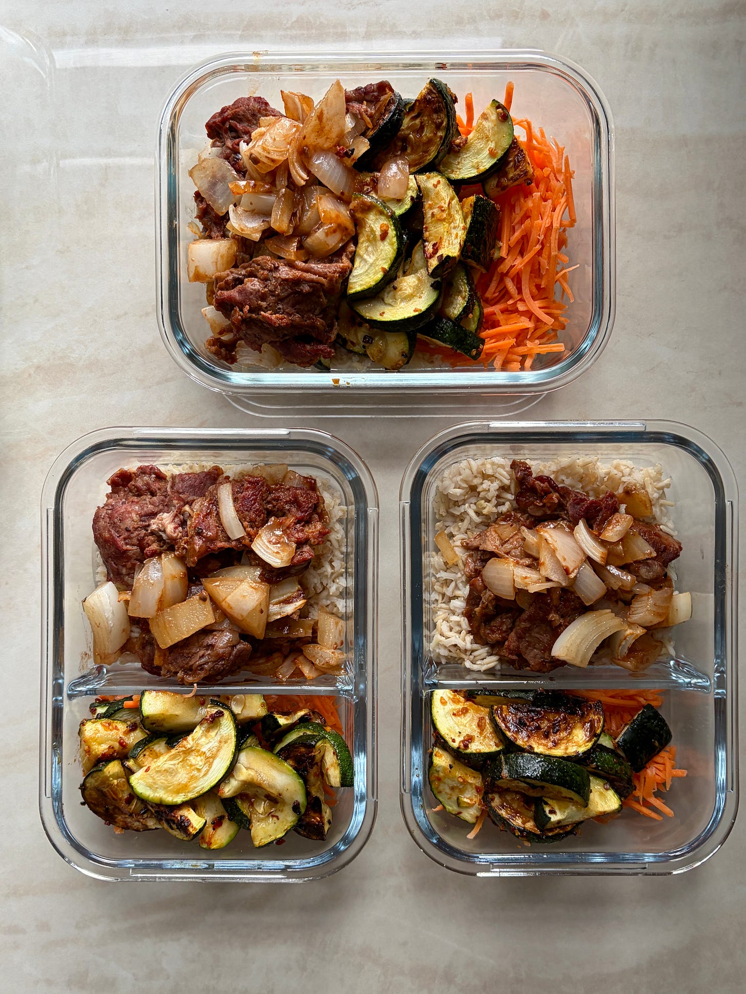 Korean BBQ shredded beef sheet pan in meal prep containers