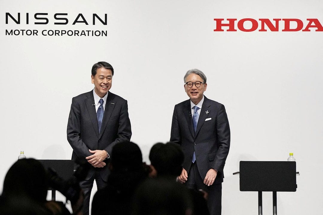 Nissan Motor CEO Makoto Uchida and Honda Motor CEO Toshihiro Mibe attend press conference in Tokyo