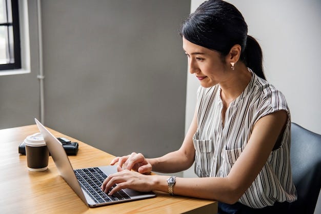 Japanese woman working on a laptop | Free Photo