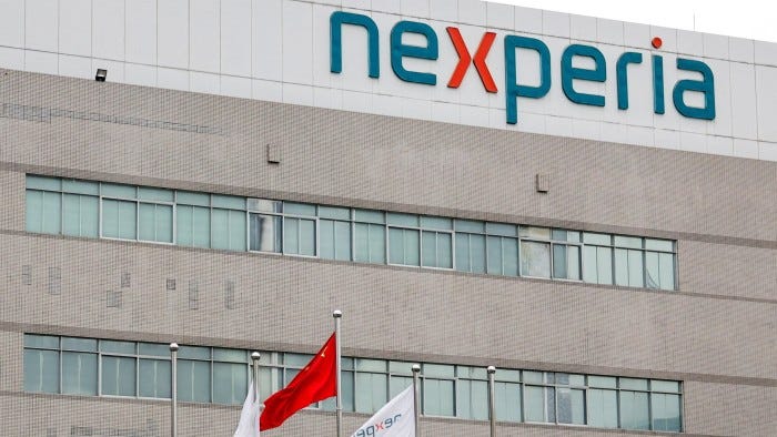 The Nexperia factory with the company logo displayed and flags, including China’s national flag, in front.