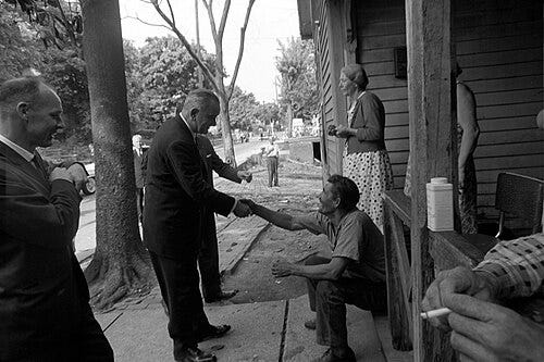 President Johnson shaking the hand of a man in Appalachia. 