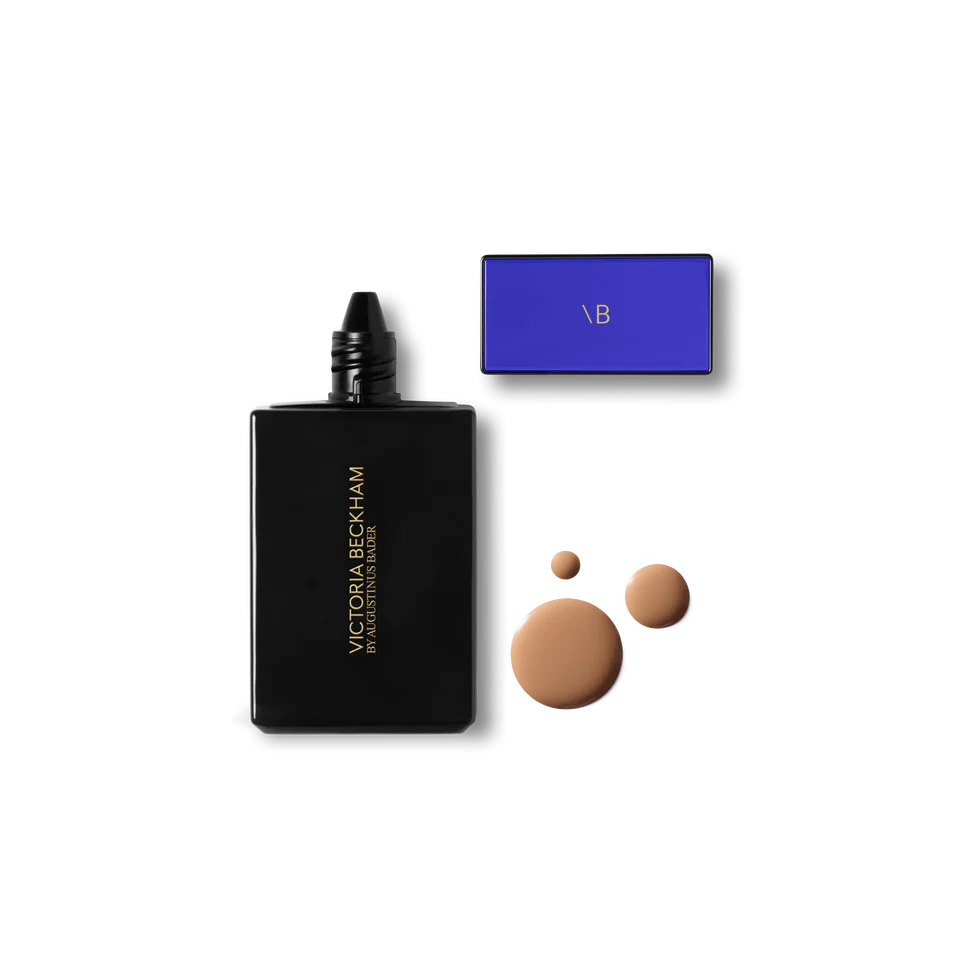 A luxury bottle of Victoria Beckham Beauty Foundation Drops with a dropper applicator, showcasing its lightweight fluid texture designed for natural, fresh skin coverage. A luxury bottle of Victoria Beckham Beauty Foundation Drops with a dropper applicator, showcasing its lightweight fluid texture designed for natural, fresh skin coverage.
