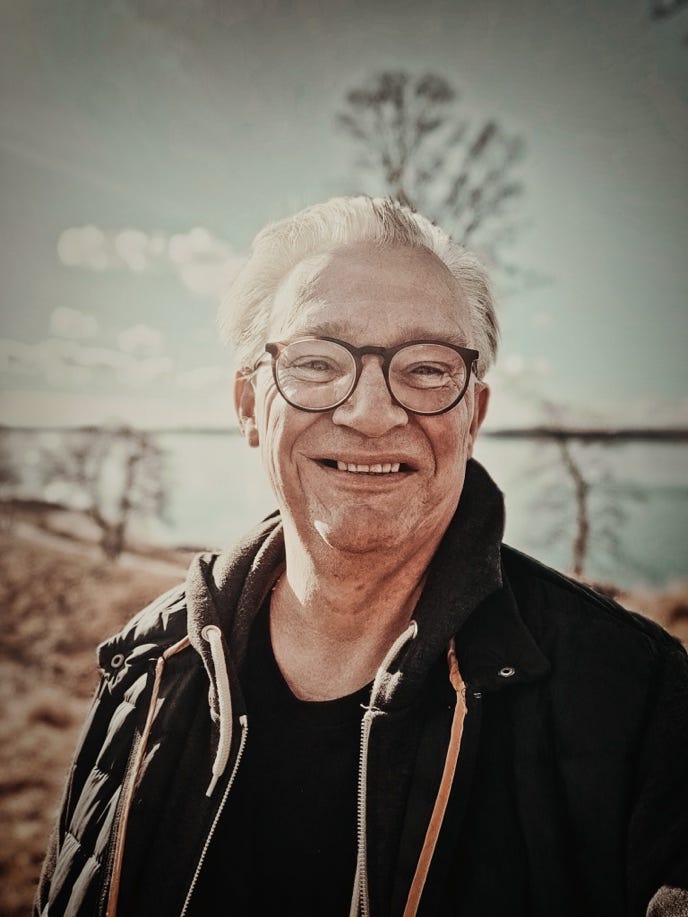 A person wearing glasses and a black jacket

AI-generated content may be incorrect.