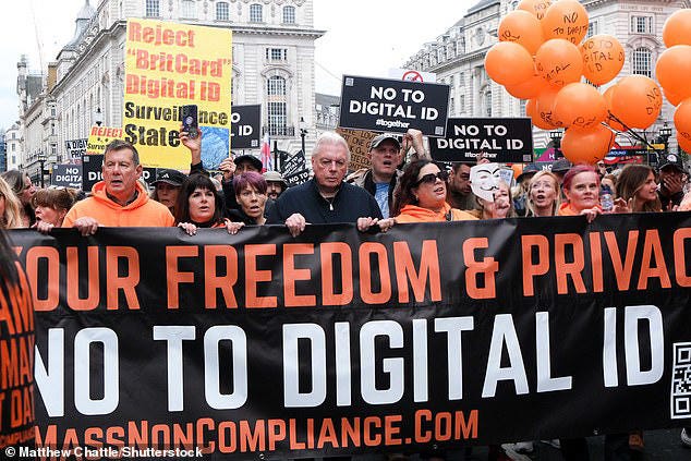 Protesters held up signs saying 'Reject 