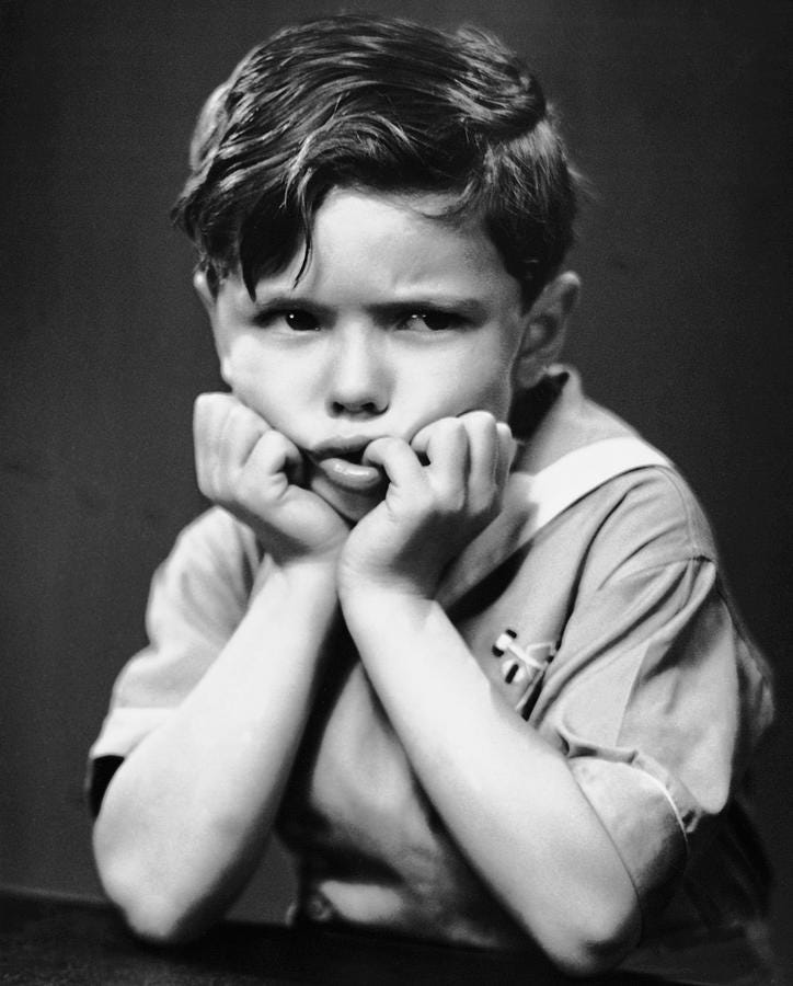 A young child with his hands on his chin

AI-generated content may be incorrect.