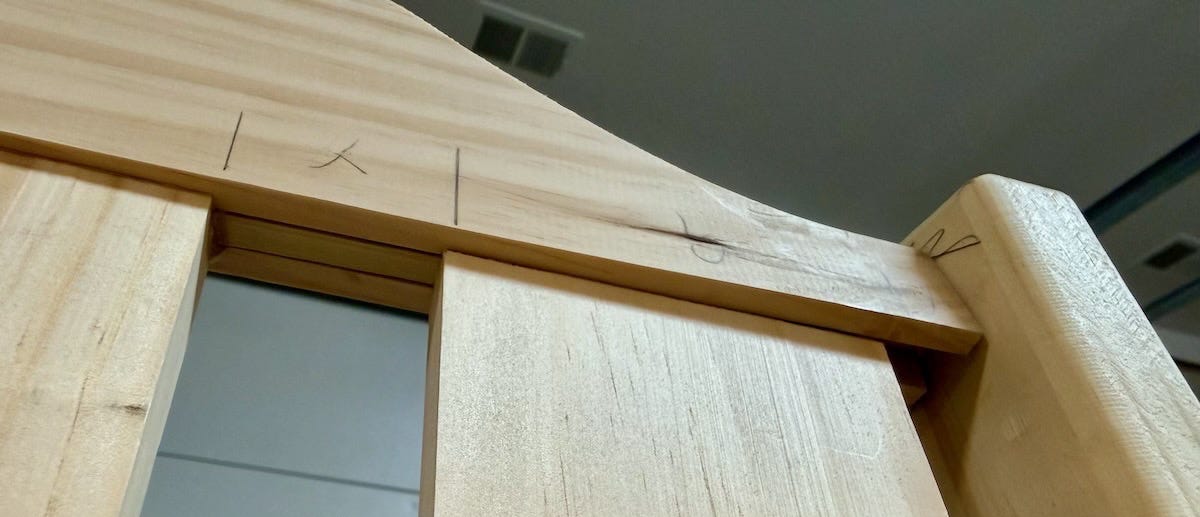 Looking up at a porch swing bench, one can see how the back rest is curved to fit the vertical supports and how the slats are fitted into the top rail. Looking up at a porch swing bench, one can see how the back rest is curved to fit the vertical supports and how the slats are fitted into the top rail.