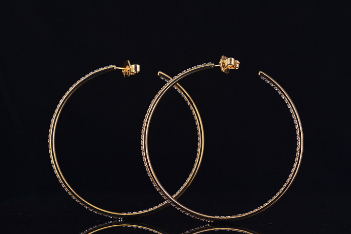 codebyEdge titanium and diamond code hoops, alongside the gold originals designed in 2011 for Sade