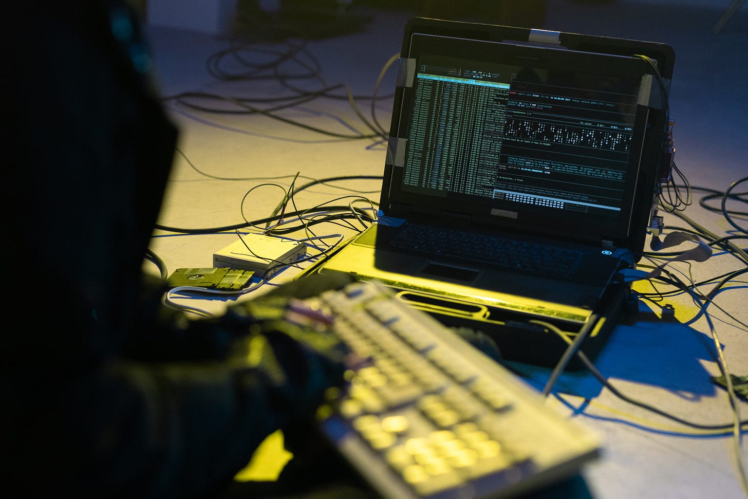 Photo of hacker computer equipment on the floor.