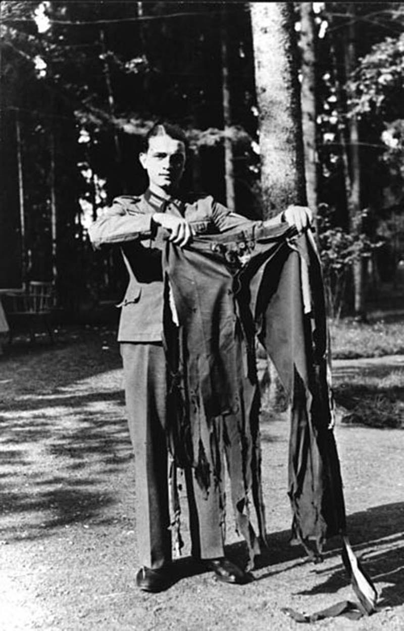 A fragment of Adolf Hitler's uniform, likely found among personal effects after the fall of the Third Reich, connecting to Eva Braun's final days. A fragment of Adolf Hitler's uniform, likely found among personal effects after the fall of the Third Reich, connecting to Eva Braun's final days.