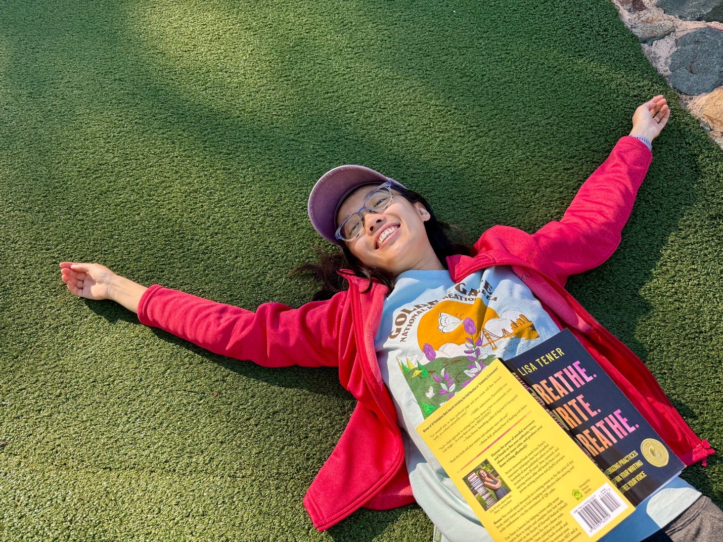 A child lying on the ground with her arms outstretched

AI-generated content may be incorrect.