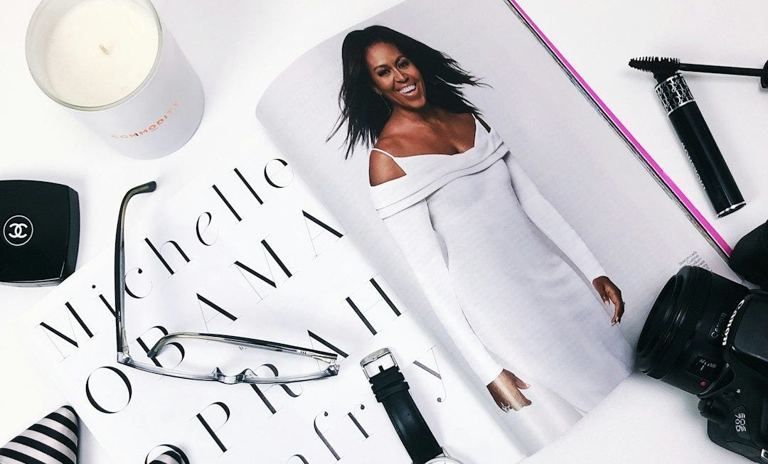 round white analog watch with black leather strap on table round white analog watch with black leather strap on table