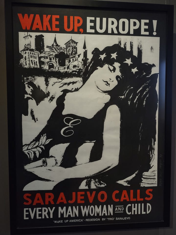 The top left image shows a black poster with barbed wire rings in the form of the olympic rings. It says "welcome to the olympic games. Welcome to Sarajevo". The top middle image shows a sign that says "enjoy Sarajevo. 1993/94" in the shape of the coca-cola logo. In the bottom it says "coca-cola logo redesigned by trio sarajevo". The top right image shows a picture of a Campbell's Soup can that says "Sarajevo';s condensed chicken with rice soup." The cna has bullet holes in it. Underneath it says "Andy Warhol Campbell Soup redeisnged by Trio Sarajevo." The bottom left image shows a poster on a blue background with the united nations logo. It says "1993. Disunited nations of Bosnia and Herzegovina." The bottom right image is of a woman on a black background with stars in her hair. She is sleeping. It says "wake up, Europe! Sarajevo calls every man woman and child."
