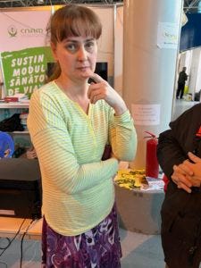 Oksana Novidskaya, from the southern Ukrainian city of Mykolayiv, arrived in the MoldExpo center with her two teenage children / credit: Fergie Chambers