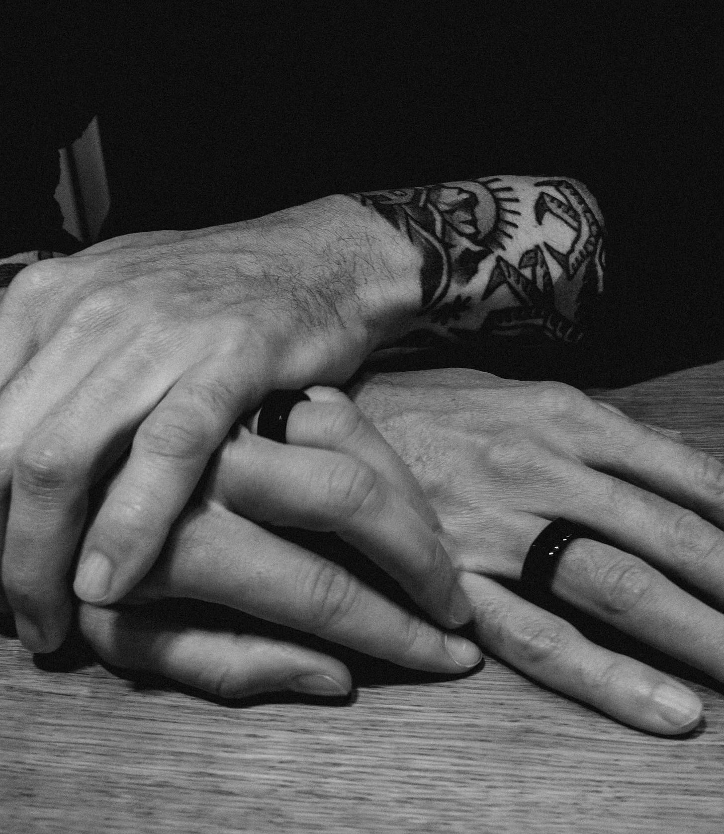 Chris holding hands with his wife Lisa