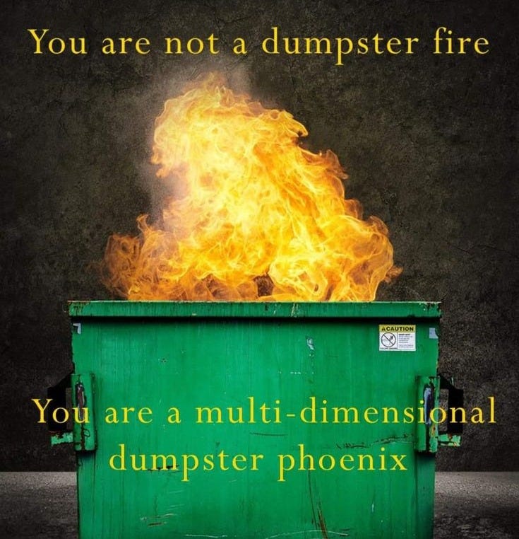 This may contain: a dumpster filled with fire sitting on top of a street This may contain: a dumpster filled with fire sitting on top of a street