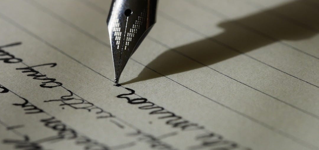 fountain pen on black lined paper fountain pen on black lined paper