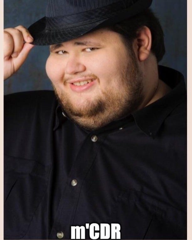 A man in a fedora tipping his hat, captioned "m'CDR".