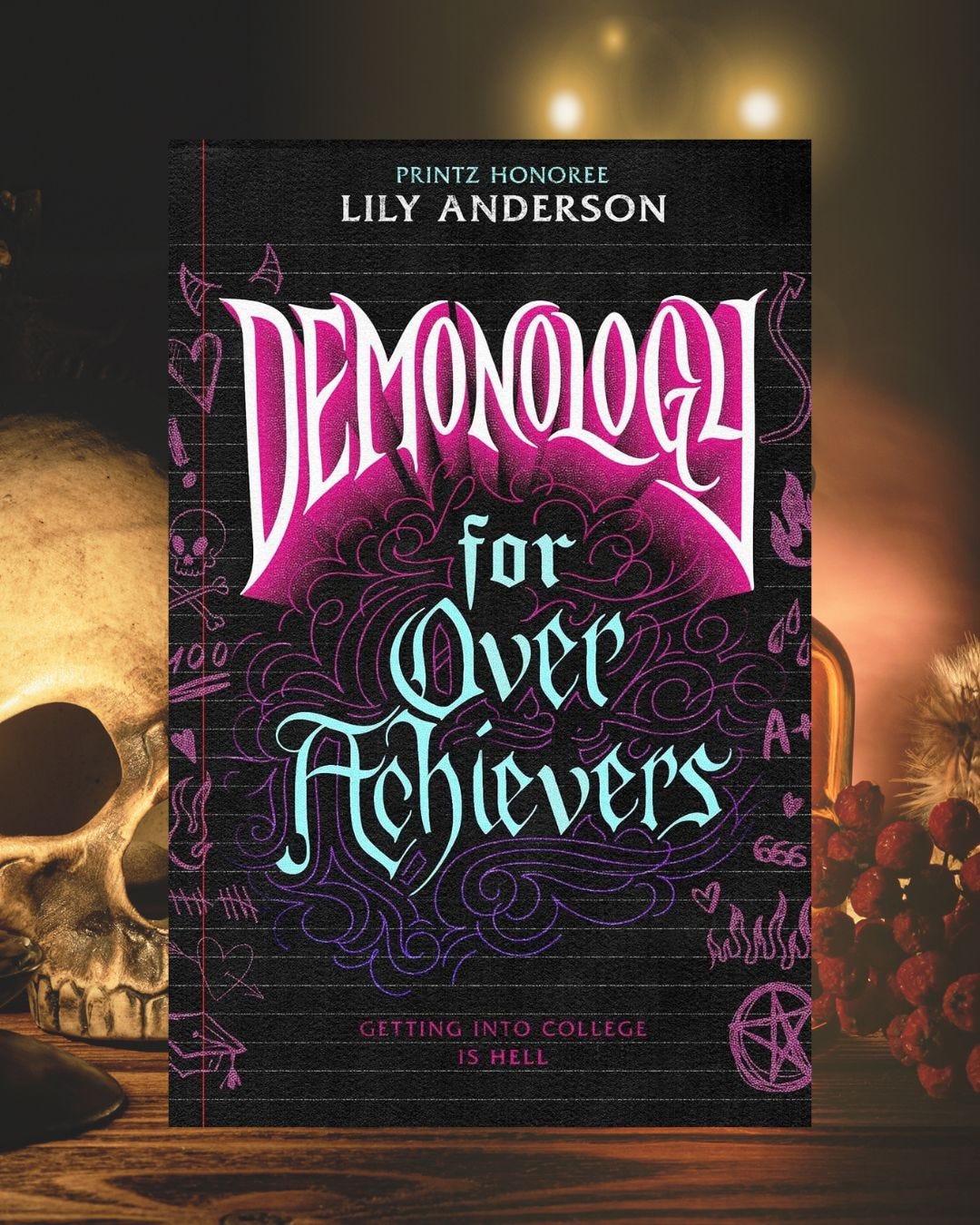 Book "Demonology for Overachievers" by Lily Anderson next to skull and candle Book "Demonology for Overachievers" by Lily Anderson next to skull and candle