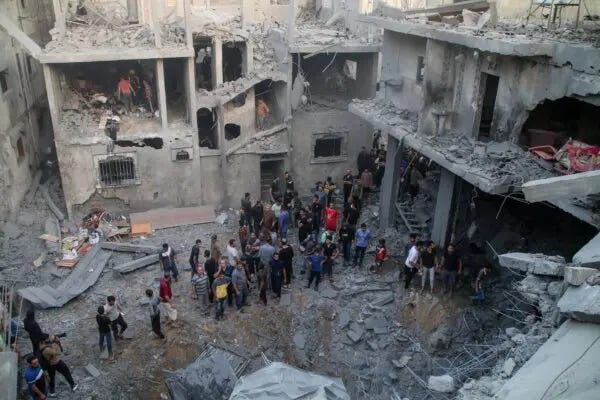 Palestinian emergency services and local citizens search for victims in buildings destroyed during Israeli air raids in the southern Gaza Strip, in Khan Yunis, Gaza, on Oct. 19, 2023. (Ahmad Hasaballah/Getty Images) Palestinian emergency services and local citizens search for victims in buildings destroyed during Israeli air raids in the southern Gaza Strip, in Khan Yunis, Gaza, on Oct. 19, 2023. (Ahmad Hasaballah/Getty Images)