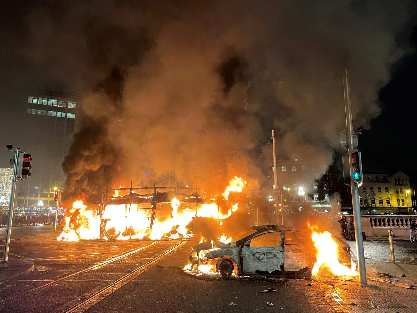 Bus and car on fire in Dublin city centre, November 23, 2023. (Photo by Brian Lawless/PA Images via Getty Images.) Bus and car on fire in Dublin city centre, November 23, 2023. (Photo by Brian Lawless/PA Images via Getty Images.)