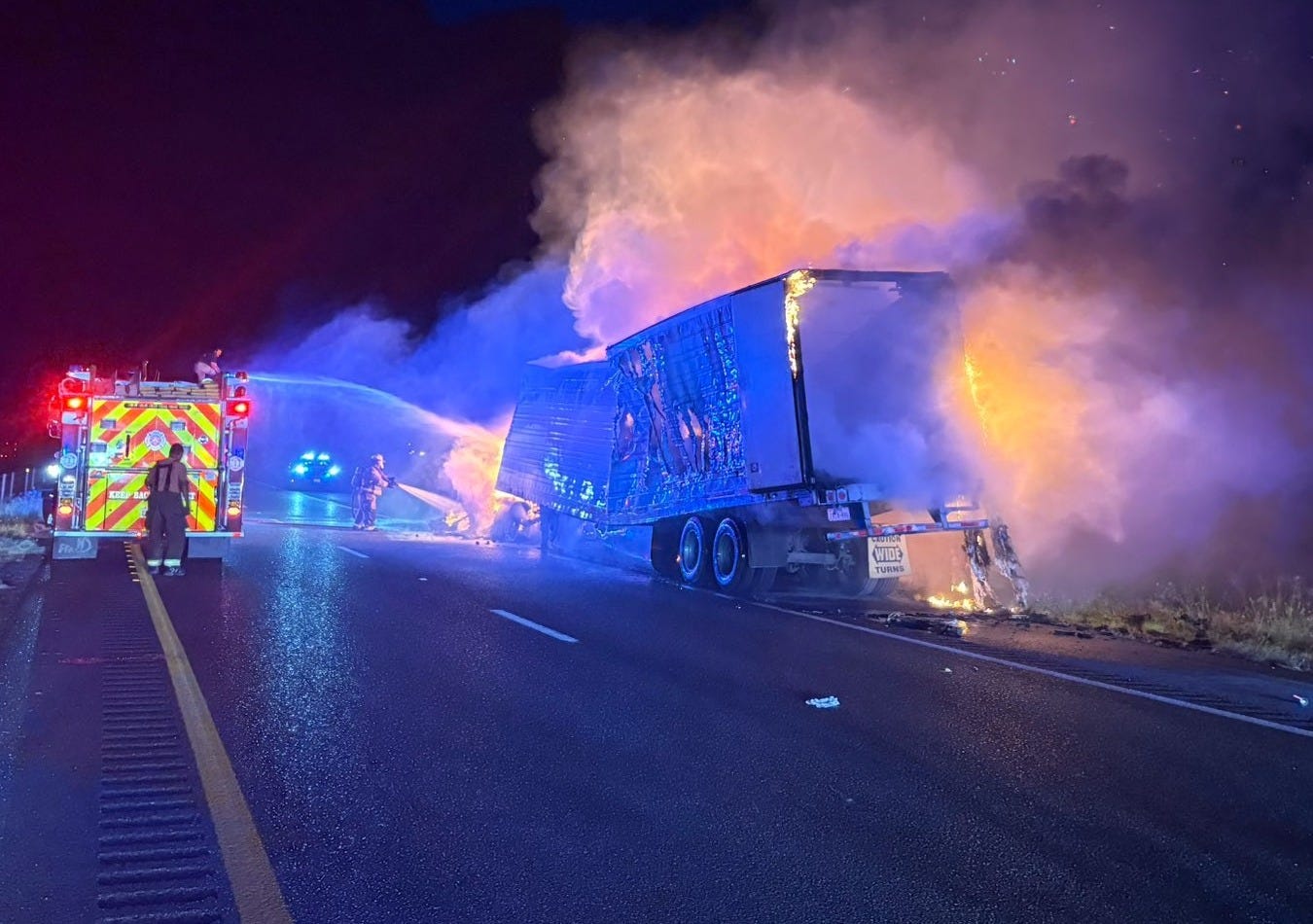 Firefighters battled to extinguish the flaming cab and trailer after all 41 aboard had been pulled to safety by US Federal and Texas State police officers.(Photo from Brooks County Sheriff Eddie Guerra)