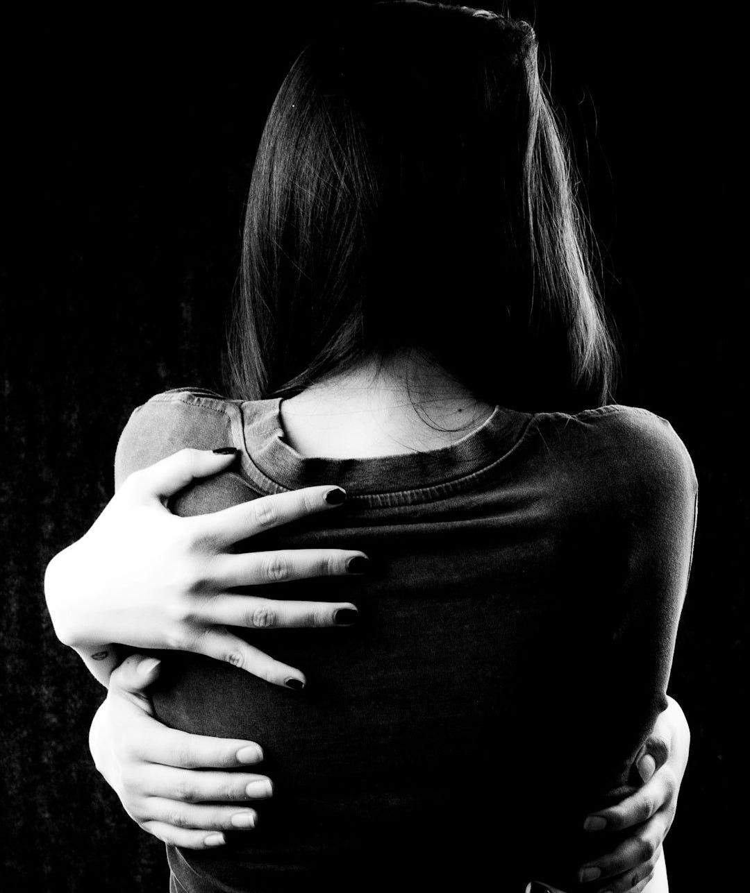 grayscale photo of woman in tank top