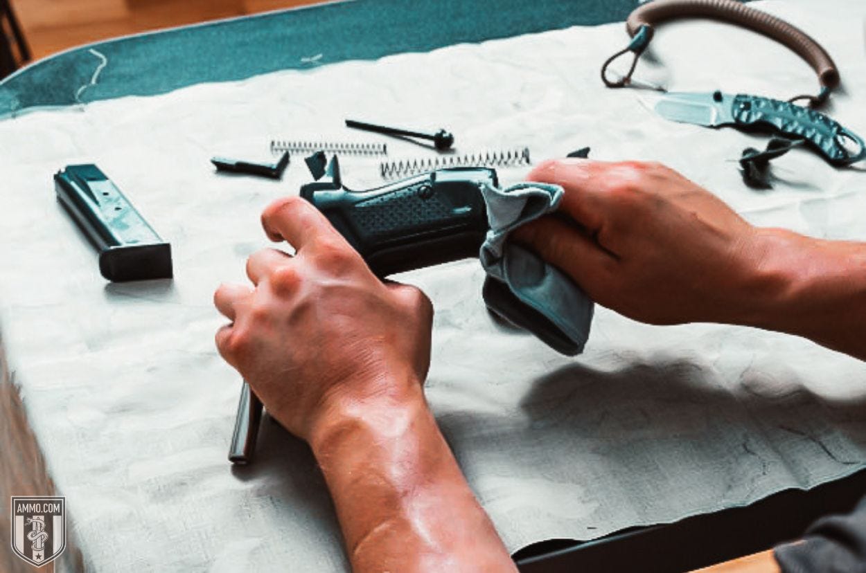 Man cleaning a gun